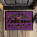 Fußmatte „Zuhause ist da, wo das Herz ist“ mit Gummirand